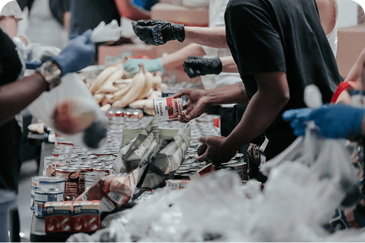 Volunteers packing food for a charity giveaway
